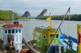 Once a simple fishing harbor, Krabi is becoming an eco-tourism center, as well as the main ferry embarkation point for islands such as Ko Lanta to the south, Ko Phi Phi to the southwest, and the beaches around Ao Nang to the west.<br/><br/>

Set on the banks of the Krabi Estuary, the town is said to take its name from a sword or krabi allegedly discovered nearby. Krabi’s surroundings are distinguished by towering limestone outcrops, a kind of Phang Nga Bay on land, and these have become the symbol of Krabi Province. Among the most notable are Khao Khanap Nam, twin limestone peaks, which stand like sentinels at each side of the Krabi River. To the east, the town is hemmed in by mangrove-lined shorelines.